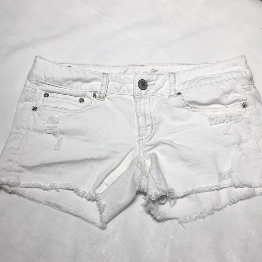 Destroyed white cut off shorts